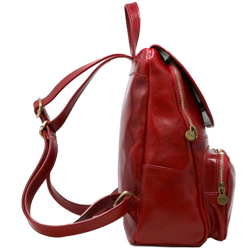 The Floto Livorno leather backpack is a wommen's fashion pack that is handcrafted in Italy. This is the Livorno Backpack in Tuscan Red. Side view.